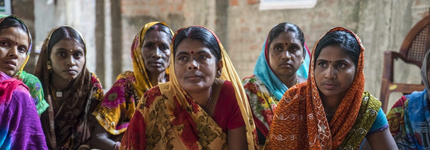 Women vegetable farmers have a discussion during a producer group meeting in Machahi village, Muzaffarpur, Bihar, India.
