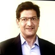 Country Director Joydeep Dutt smiling at the camera